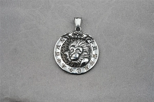 Detail of vintage zodiac monkey pendant in blackened titanium steel with Chinese characters
