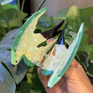 Chic swallow bird hair claw clip in pearlescent green and white PVC for creative styling