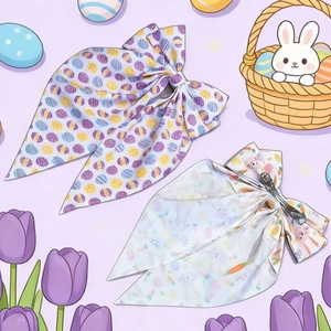 Detail view of Easter bow hair clips with colorful bunny and egg prints on fabric