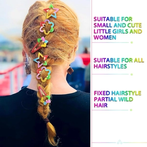 Detailed view of colorful star and flower hair clips styled on a braided blonde hairstyle