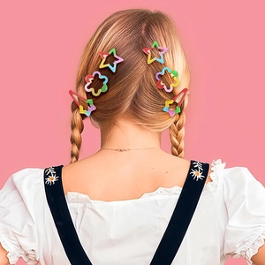 Colorful star and flower hair clips styled on blonde hair with vibrant dopamine colors