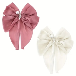 Set of two satin bow hair clips with large pearls in dusty pink and cream white