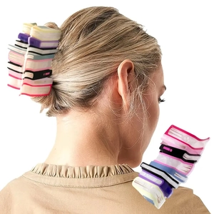 Detail showing a colorful stacked books hair claw clip worn on blonde hair for thick styling