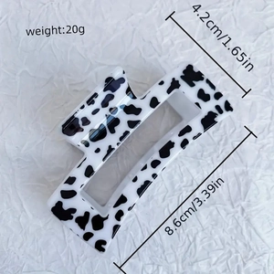 Rectangle cow print hair claw clip in black and white pattern for women hair styling