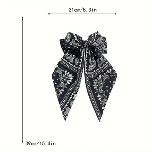 Vintage paisley pattern oversized bow hair clip with long tails and 21cm width dimensions