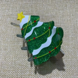 Sparkly green Christmas tree hair claw clip with colorful festive ornaments