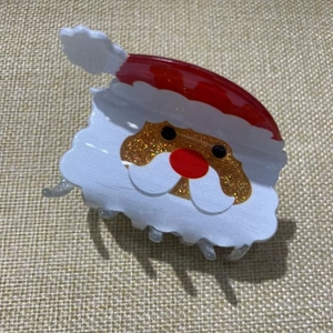 Cute Santa Claus hair claw clip in classic red and white colors with gold glitter accents