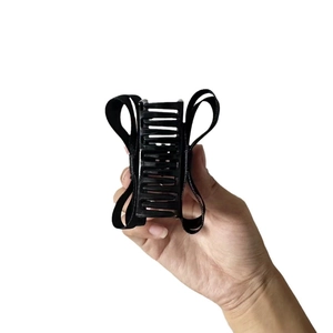 Elegante pinza per capelli con fiocco in nastro nero e design a più denti per coda