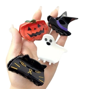 Halloween claw clip set with pumpkin, ghost, witch hat, and black cat motifs for women