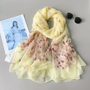 Elegant pale yellow floral silk scarf for summer with pink blossoms and tag