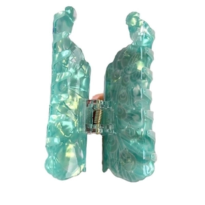 Elegante pinza per capelli a forma di H in acetato turchese con trama marmorizzata