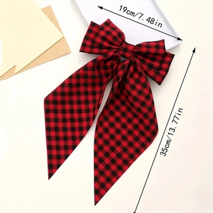 Detailed view of a red plaid bow hair clip showing dimensions 19cm by 35cm long