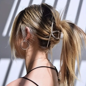 Minimalist silver metal hair claw clip for elegant ponytail styling and secure hair grip