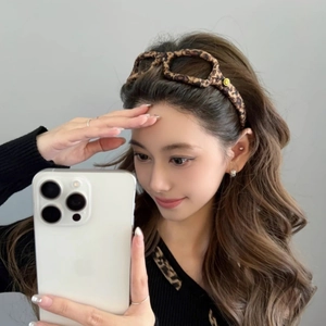Elegant leopard print headband with eyeglass design and yellow smiley face patch