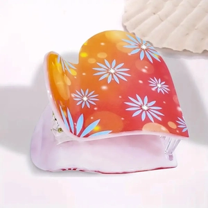 Pince à cheveux en forme de cœur avec motifs marguerites bleues et dégradé orange vif