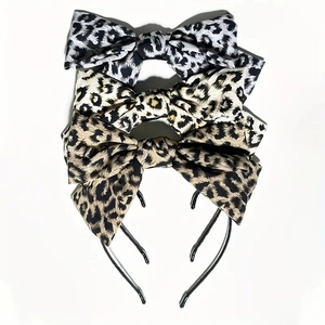 Detailed set of three leopard print bow headbands in black, beige and tan fabric