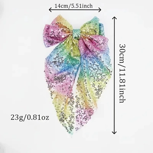 Détail du nœud papillon à paillettes colorées montrant les dimensions 14cm sur 30cm