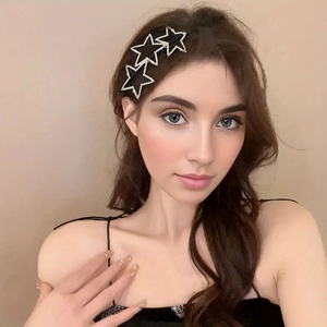 Sparkling rhinestone star headband with black metal base for elegant holiday parties