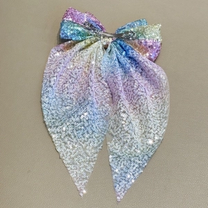 Barrette à cheveux avec nœud en paillettes arc-en-ciel, longs rubans et clip métallique