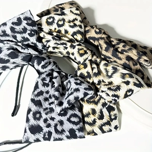 Set of four stylish leopard print bow headbands in various colors for women's fashion