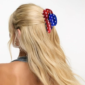 Close-up of patriotic American flag claw clip in hair with stars and stripes pattern
