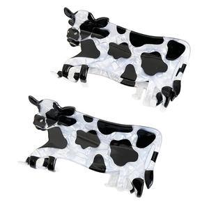 Set di due simpatiche mollette per capelli a forma di mucca con macchie bianche e nere