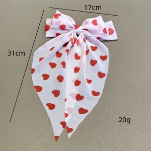 Nœud pour cheveux blanc avec cœurs rouges et longs rubans, dimensions 17x31cm chic