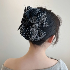 Elegant black paisley bow hair claw clip for women's daily hair styling and updo hairstyle