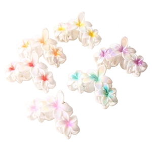 Pearlescent plumeria flower hair clips with colorful centers for sweet vacation styles