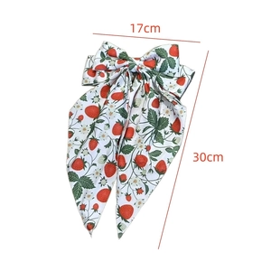 Floral strawberry print bow hair clip with long ribbon streamers for vacation style