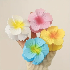 Elegant frangipani flower hair claws in multiple colors for stylish hair styling