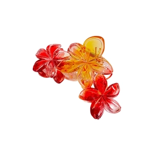 Vue détaillée de la pince à cheveux fleur tropicale avec dégradé de résine vibrant