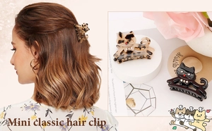 Vue détaillée des mini pinces à cheveux chat avec motif léopard et strass brillants