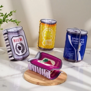 Set of four creative PVC beer and soda can hair claws on a marble and wood surface