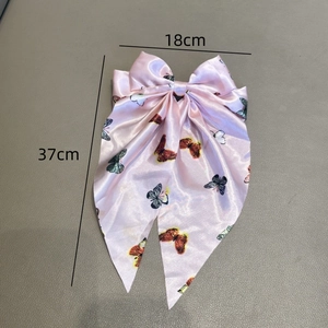 Nœud à cheveux en soie rose avec imprimés papillons colorés et longs rubans, 18x37cm