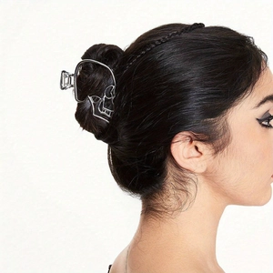 Gothic hollow skull metal hair claw clip in silver finish worn on model
