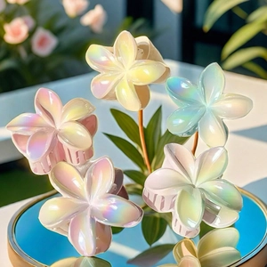 Colorful gradient plumeria flower hair claws with pearlescent finish for women