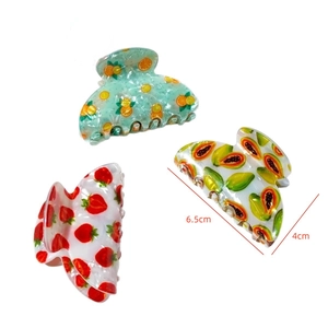 Three-piece fruit print hair claws featuring strawberry papaya and orange 6.5cm length