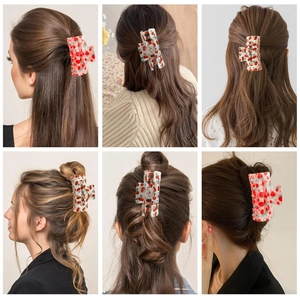 Detailed views of strawberry and cherry print square hair claws used on diverse hairstyles