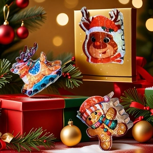 Holographic Christmas hair claws featuring reindeer and gingerbread man shapes in gift box
