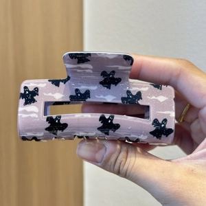 Pale pink ghost claw clip with cute Halloween patterns for spooky hair styling