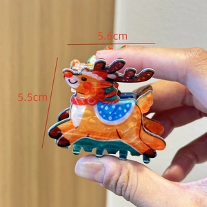 Detailed view of cartoon reindeer hair claw clip showing precise 5.6cm by 5.5cm dimensions