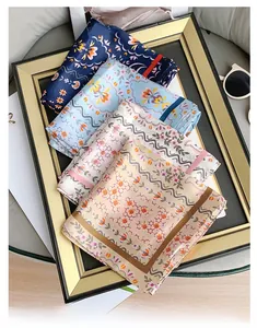 Detail showing various silk scarves with floral patterns and stylish frame layout