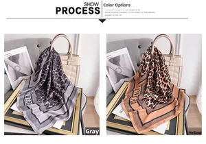 Close-up of leopard print satin scarves in grey and yellow used as handbag accessories