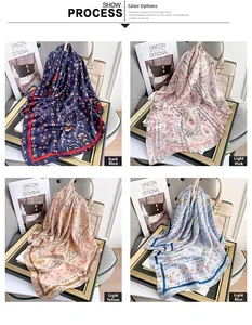Detail of four floral silk scarves in navy, pink, yellow, and blue with satin finish