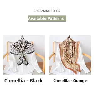 Detail of camellia pattern silk scarves in black and orange hanging on white shirts