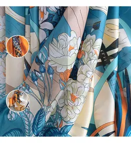 Close-up of lightweight floral silk scarf with vibrant colorful printed patterns and textures