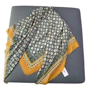 Minimalist blue geometric cotton scarf with yellow trim and fringe details