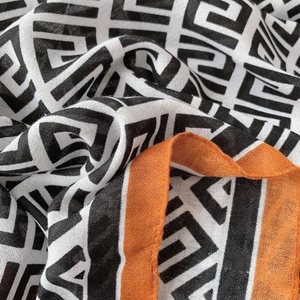 Lightweight cotton linen shawl with geometric maze pattern and orange edges