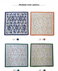 Détail de quatre foulards en soie imprimés floraux avec bordures géométriques losanges